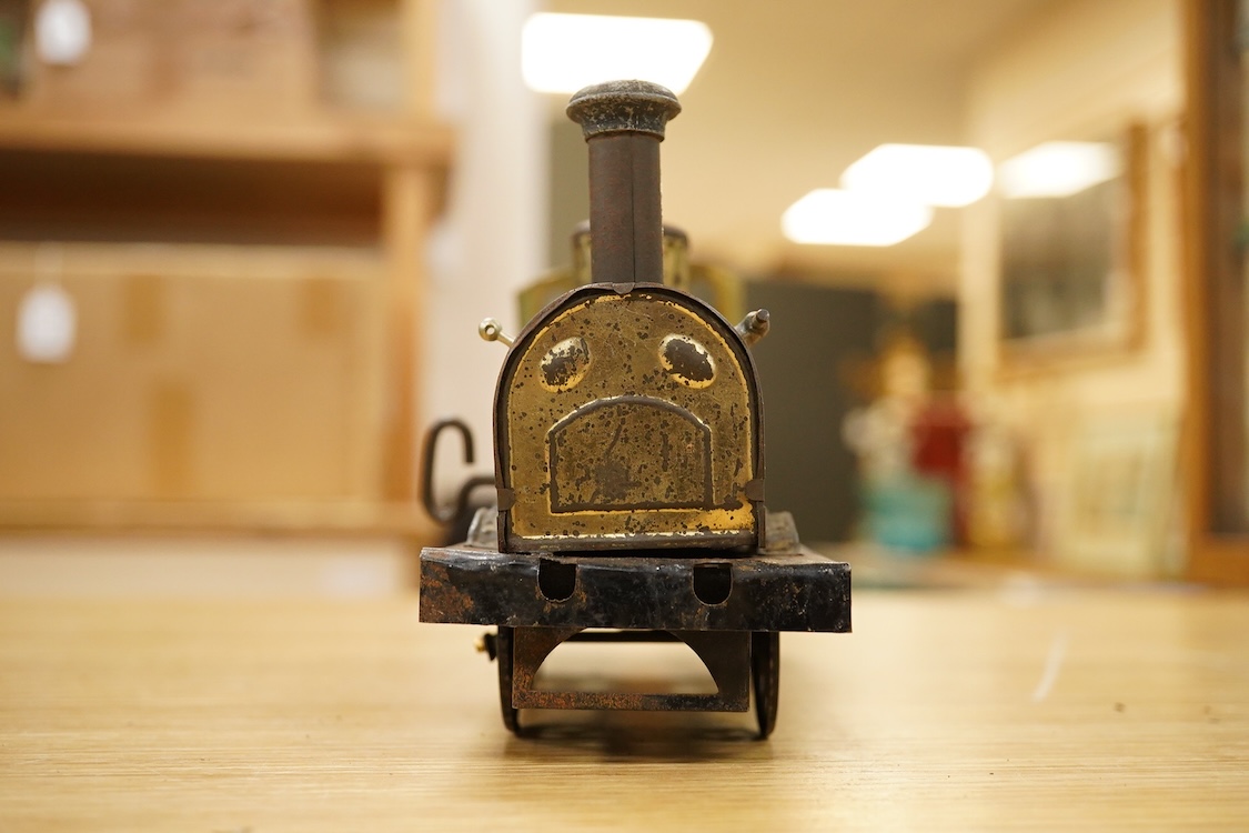 Seven Gauge One coarse scale railway freight wagons, by Bassett-Lowke, etc., including tinplate and wooden examples in liveries for LNWR, Midland Railway, and LBSCR, together with the remains of a scarce late 19th centur